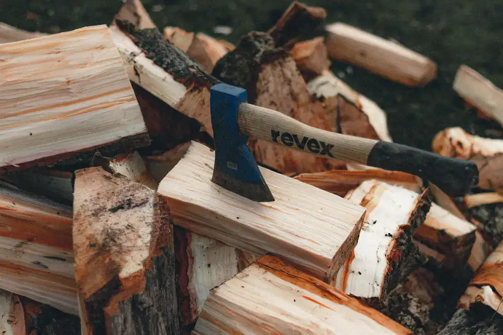 An axe firmly embedded in a wooden target ring